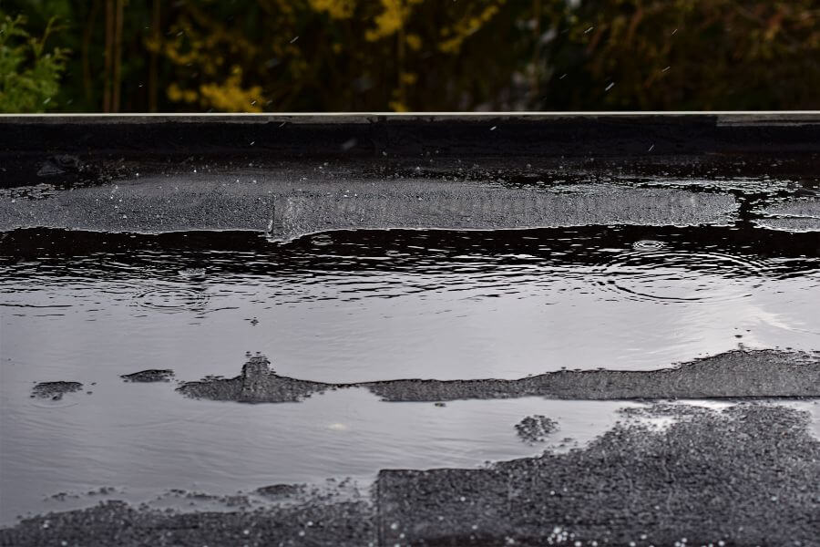 how to fix water ponding on flat roof