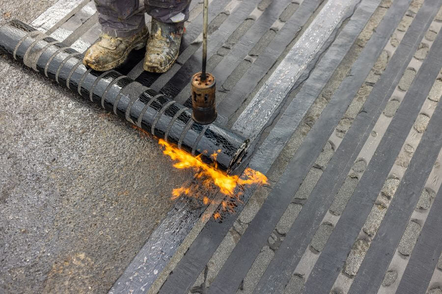 modified bitumen installation on flat roof using touch down method