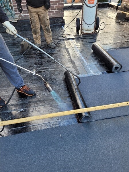 flat roofing contractor for roof replacement services