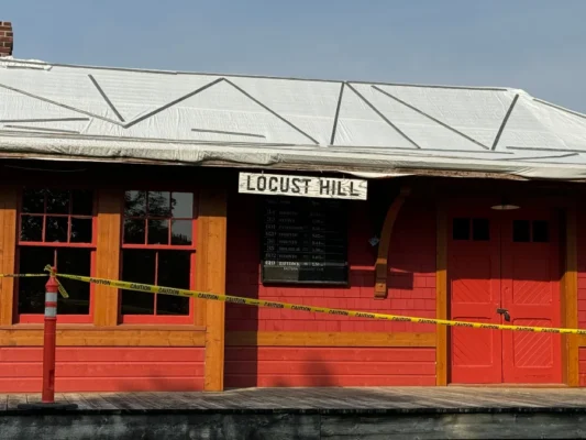 fixing shingles of historic building markham museum locust hill station full shot