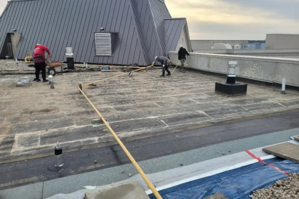 removing old flat roofing system