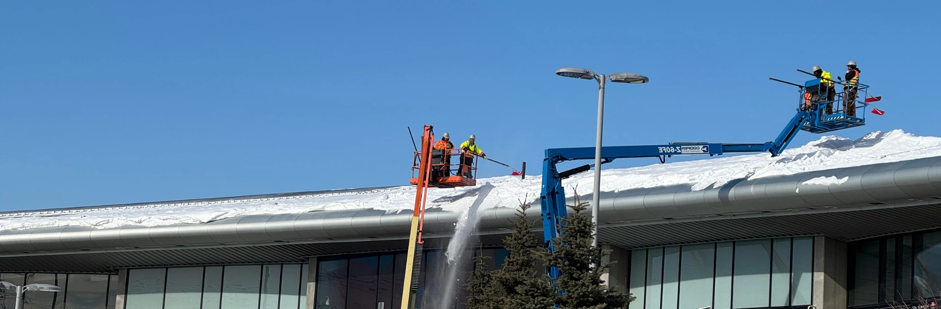 book snow removals for flat commercial roofs